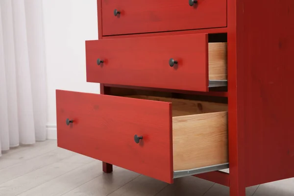 Beautiful wardrobe with open drawers indoors — Stock Photo, Image