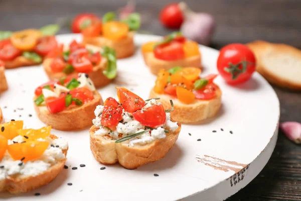 Tasty bruschettas with tomatoes — Stock Photo, Image