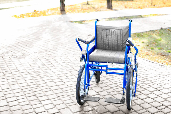 Blue wheelchair outdoors