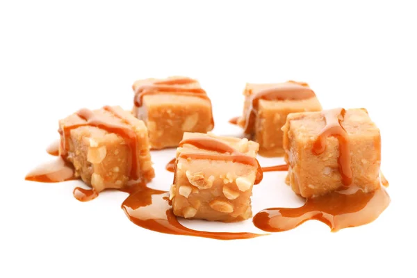 Delicious candies with caramel sauce — Stock Photo, Image