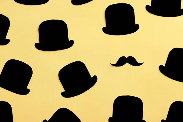 Paper hats and moustache on color background. Father's Day composition — Stock Photo, Image