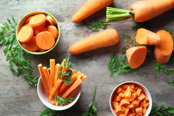 Bowls with cut carrot — Stock Photo, Image