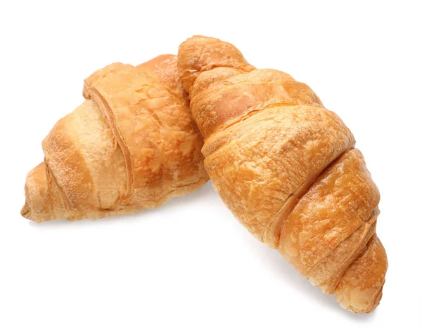 Läckra croissanter på vit — Stockfoto