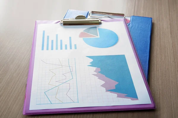 Clipboard with document on table — Stock Photo, Image