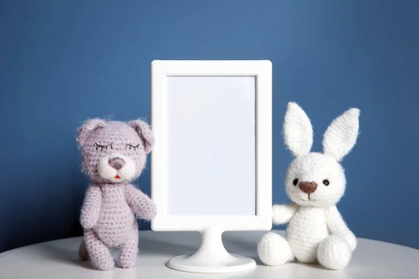 Mockup of blank frame with toys on color background — Stock Photo, Image