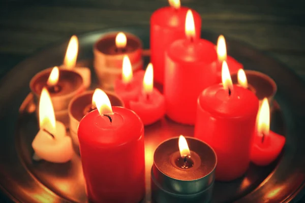 Burning candles on tray, closeup — Stock Photo, Image