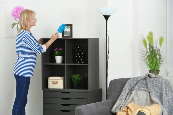 Mature woman cleaning her flat — Stock Photo, Image