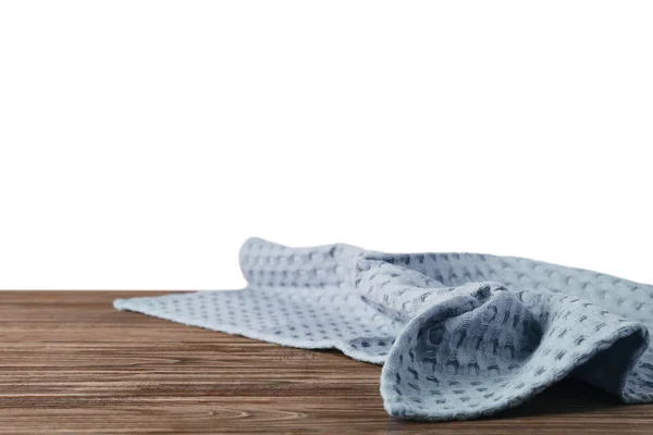 Asciugamano da cucina pulito sul tavolo contro lo sfondo bianco — Foto Stock