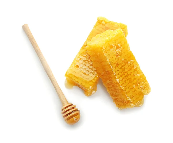 Fresh honeycombs with wooden dipper on white background — Stock Photo, Image