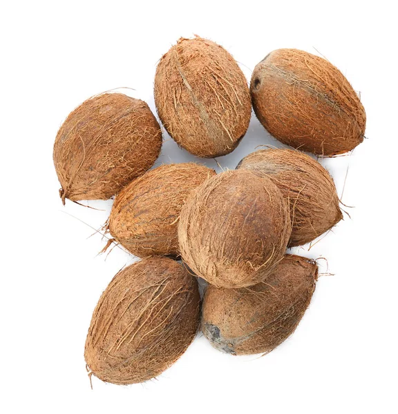 Many ripe coconuts on white background — Stock Photo, Image