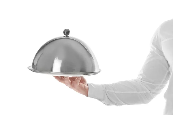 Cameriere con vassoio in metallo e cloche su sfondo bianco — Foto Stock