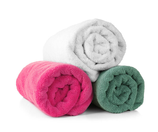 Rolled terry towels on white background