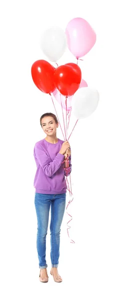 Giovane donna con palloncini a forma di cuore — Foto Stock