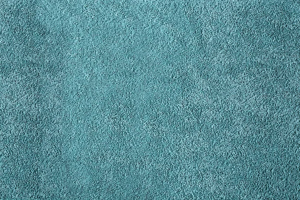 Цвет махровое полотенце в качестве фона — стоковое фото