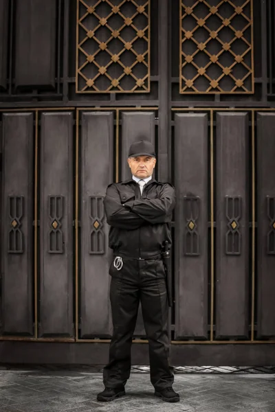 Male security guard standing outdoors — Stock Photo, Image