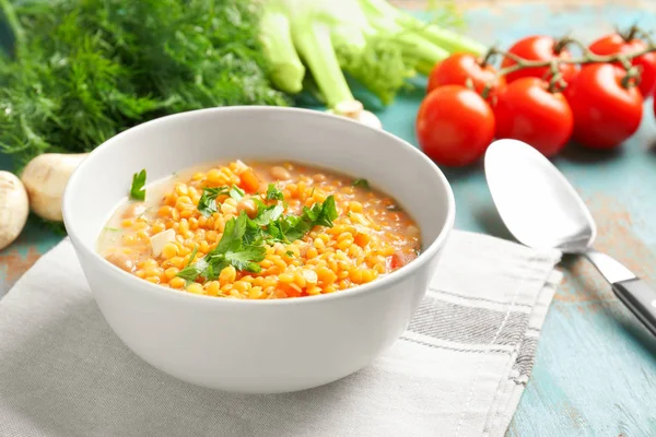 Dish with tasty lentil soup on table — Stock Photo, Image