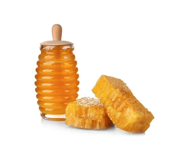 Aromatic honey in jar and honeycombs on white background — Stock Photo, Image