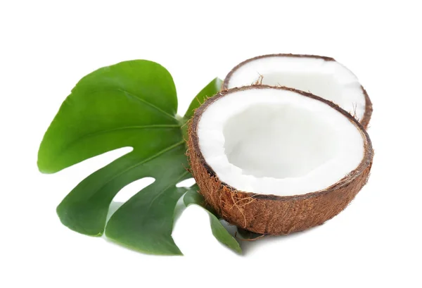 Halves of coconut with leaf on white background — Stock Photo, Image