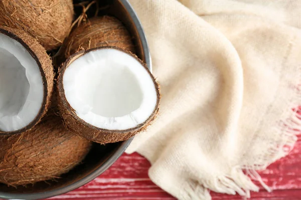 Bowl with fresh coconuts on table — Stock Photo, Image