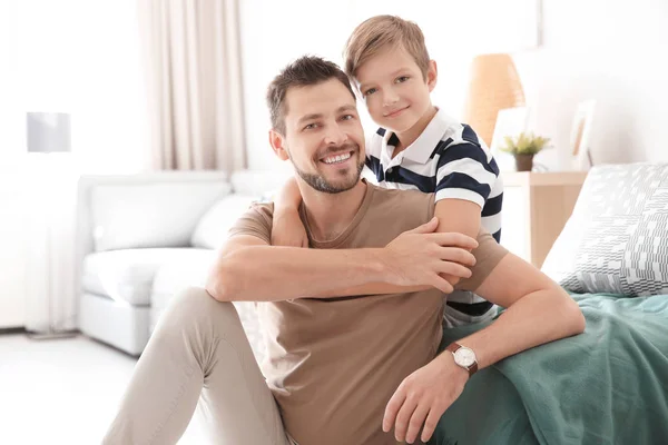 Cute little boy and father at home — Stock Photo, Image