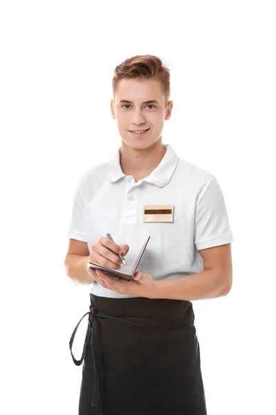 Guapo joven camarero anotando orden, sobre fondo blanco — Foto de Stock