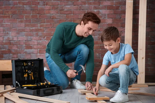 Father and his little son with tools in workshop — Stock Photo, Image