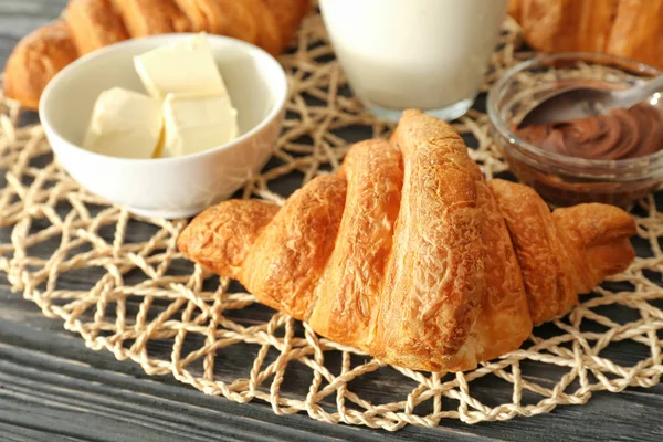 Tasty croissant on table — Stock Photo, Image