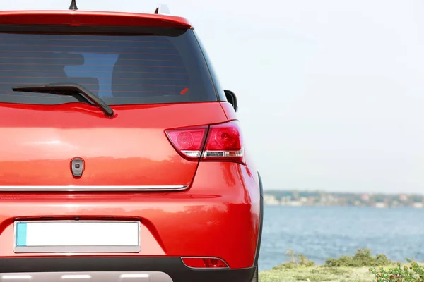 Modern car on river bank — Stock Photo, Image