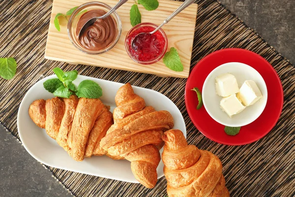 Tasty croissants on table — Stock Photo, Image