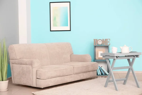Stylish sofa in interior of living room — Stock Photo, Image