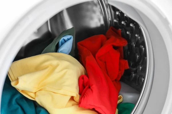 Different clothes in washing machine for laundry, closeup — Stock Photo, Image