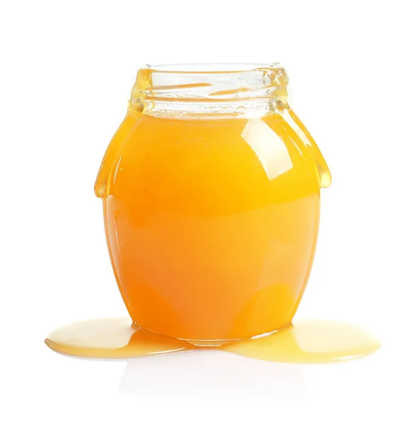 Glazen Pot Met Heerlijke Honing Witte Achtergrond — Stockfoto