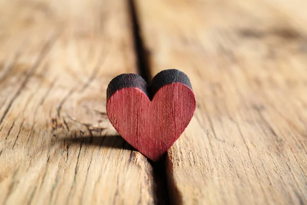 Small heart on wooden background — Stock Photo, Image