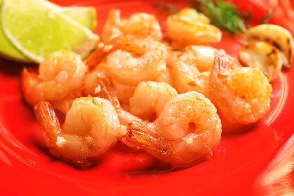 Delicious fried shrimps with chopped garlic, closeup