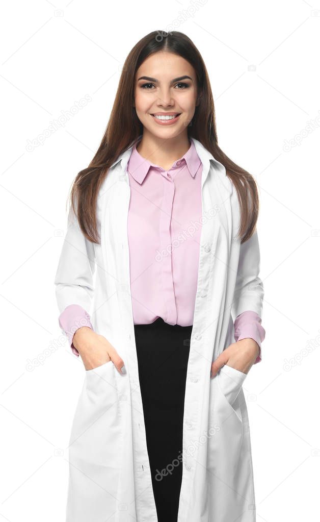 Young female pharmacist on white background