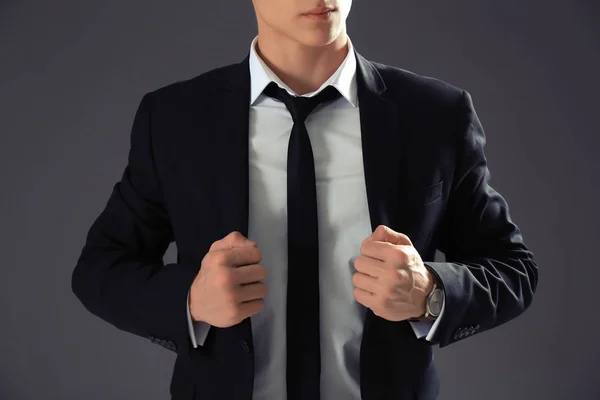 Handsome man in formal suit on grey background, closeup — Stock Photo, Image