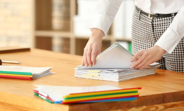 Young woman working with documents in archive — Stock Photo, Image