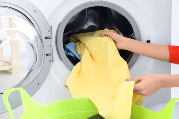 Young woman doing laundry, closeup — Stock Photo, Image