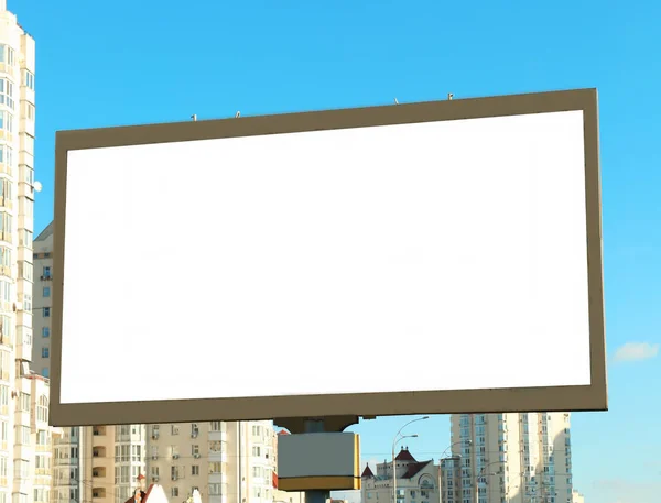 Blank advertising board on city street — Stock Photo, Image