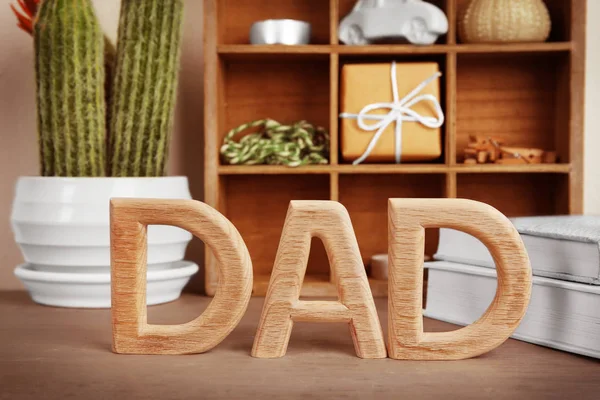 Word "Dad" made of wooden letters on table. Father's Day celebration — Stock Photo, Image