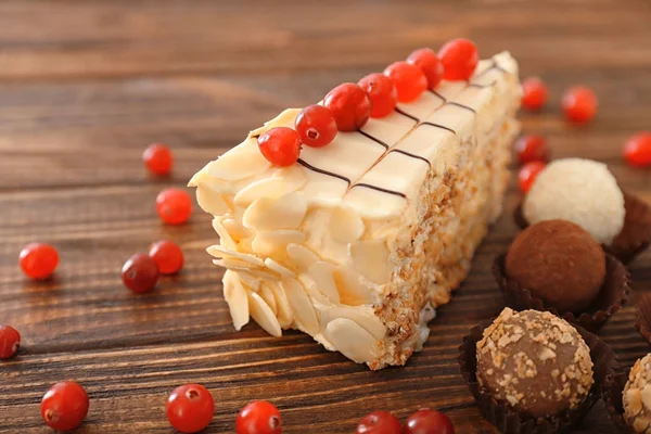 Piece Tasty Esterhazy Cake Candies Wooden Background — Stock Photo, Image