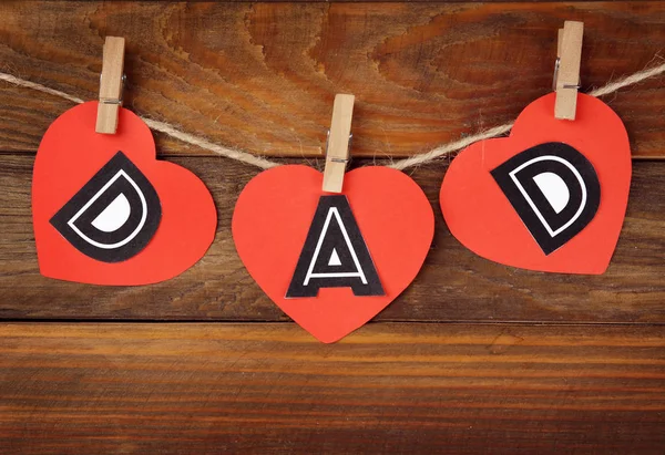 Word Dad Made Paper Hearts Greeting Father Day String Wooden — Stock Photo, Image