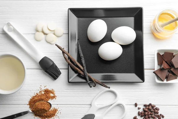 Ingredients and utensils for cooking pastries on wooden background — Stock Photo, Image