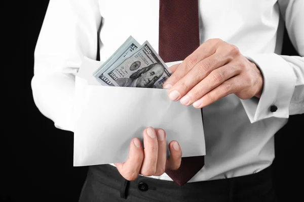 Businessman Holding Envelope Money Black Background Closeup Corruption Concept — Stock Photo, Image