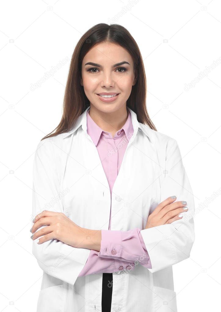 Young female pharmacist on white background