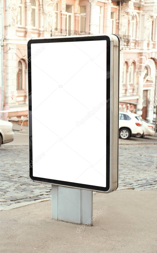 Blank advertising board on city street