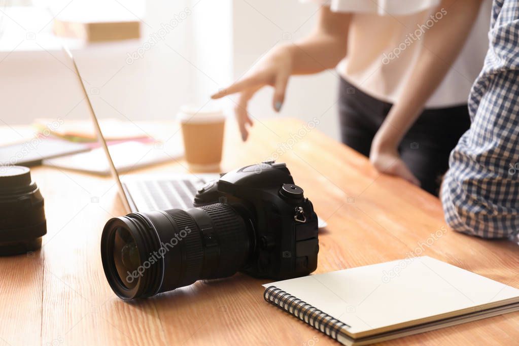 Professional camera on table indoors