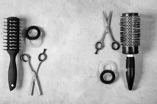 Professional hairdresser set on gray table — Stock Photo, Image