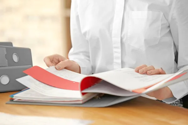 Young woman working with documents in archive — Stock Photo, Image