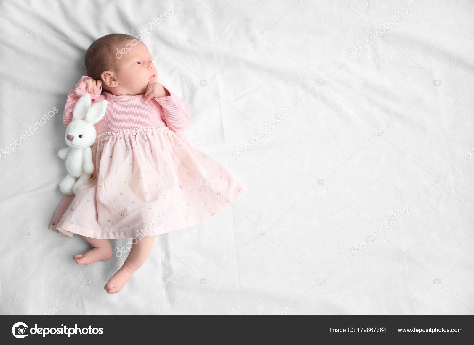 Cute Newborn Baby Girl Lying On Bed Stock Photo By C Belchonock